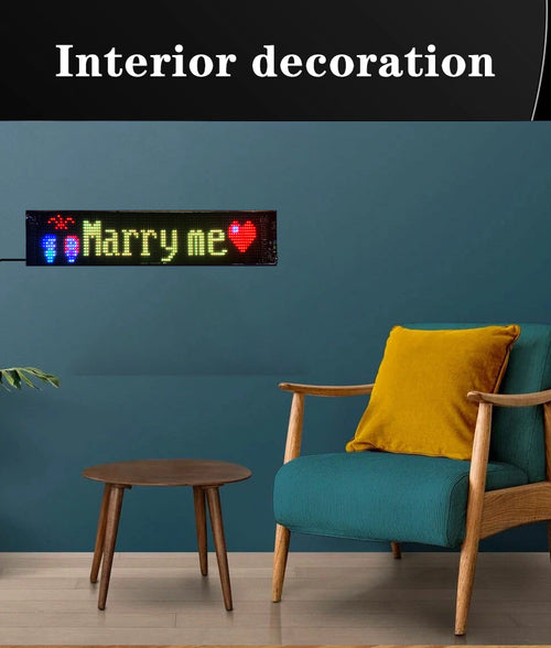 Soft LED sign on a living room wall showing "Marry me"